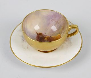 A Royal Worcester hand painted coffee cup and saucer, by Harry Stinton, decorated with landscape sce