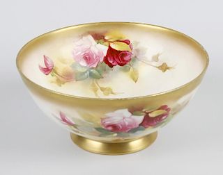 A Royal Worcester porcelain bowl, of circular form, decorated with roses by E Spilsbury, with manufa
