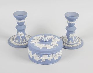 Two boxes of Wedgwood blue jasperware items, to include various shaped lidded boxes, candlesticks, b