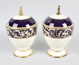 A pair of Wedgwood Cornucopia urns with covers, of ovoid form, decorated with mythical design featur