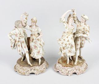 A large pair of Schierholz German porcelain candelabra, each modelled as a semi-nude female figure s