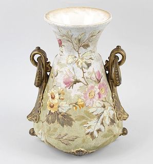 A Continental two-handled vase, of tapering form with twin shell and ring scrolling handles below a