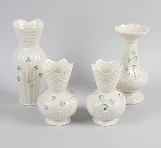 A collection of Belleek china wares. Each having shamrock decoration upon a cream ground, to include