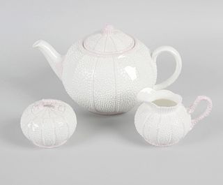 A Belleek style sea anemone pattern tea service, to include six teacups, eight saucers, eight side p
