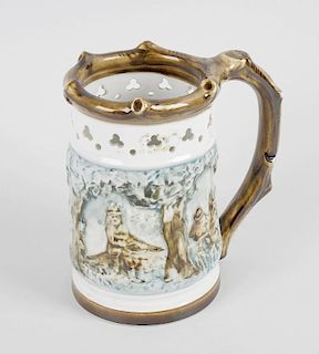 A Royal Dux porcelain puzzle jug, decorated with low relief continuous woodland hunting scene below