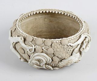 A Japanese pottery bowl or planter, of squat form decorated with continuous waterside scene of birds