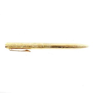 An Alfred Dunhill 9ct gold ballpoint pen, with molten textured body, twist mechanism, hallmarked Lon