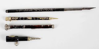 Three decorative pencils, two with tortoiseshell body, having pique work decoration leading to a gem