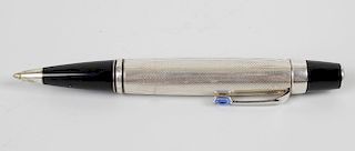 A Montblanc Boheme bleu ball point pen, having silver engine turned body and sapphire coloured gem s