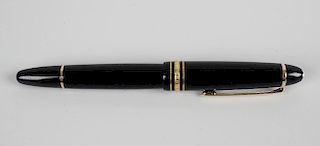 A Montblanc Meisterstuck fountain pen, the black lacquered body with metal banding, the bicolour nib
