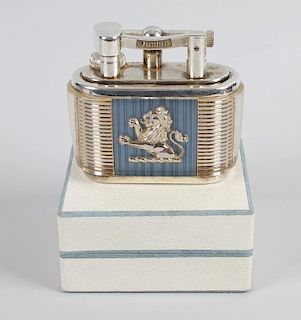 A good Lucas Dunhill silver plated table lighter. Having dual rampant lions upon a blue and silvered