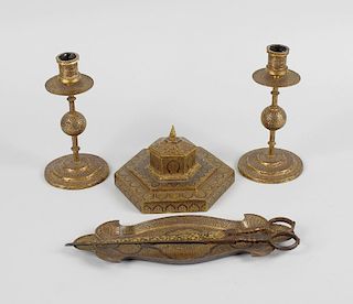An Indo-Persian damascened three-piece desk set, comprising a pair of candle sticks, an inkwell and