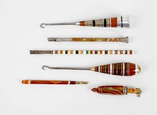 A group of agate and hardstone items, to include two hardstone boot pulls, an agate scent bottle, tw