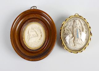 A 19th century French gilt metal pendant or brooch, with inset oval composition panel depicting the
