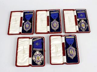 Five late 1920’s and early 1930’s enamelled silver medals presented by the Central Currant Office, e