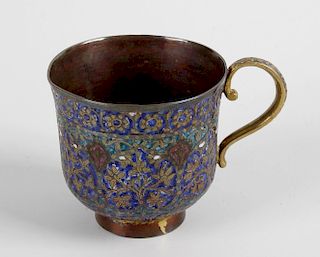 An antique Persian gilt metal cup, with enameled and chased decoration depicting flowers and foliage