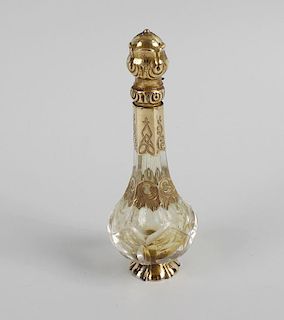 An unusual 19th century French yellow metal mounted glass scent bottle, of slender baluster shaped f