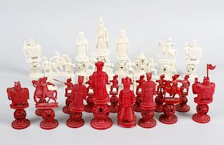 A 19th century Chinese Canton carved ivory chess set, of red stained and natural colour, each of thr