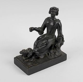 A bronze figure, circa 1800 modelled as a shepherdess seated on a tree stump beside a lamb, upon nat