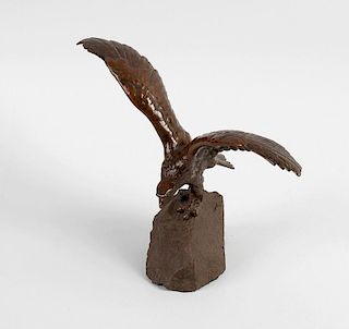 A late 19th century “Bergman” bronze study of an eagle with outstretched wings, perched upon a rocky