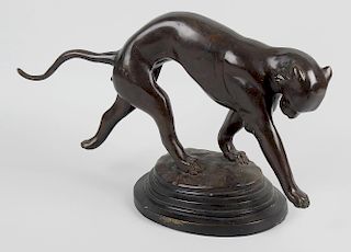 A bronze figure of a panther, modelled in running pose, upon stepped oval base, 10.25 x 17 (26cm x 4