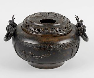 A large bronze incense burner and cover, the domed pierced lid depicting an elder seated among prunu