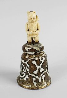 A late 19th century Chinese table bell, the enameled shaped bell engraved with a band of bats, and j