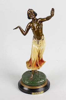 A painted spelter figure. 'Danse', modelled as a topless exotic dancer with arms outstretched, with