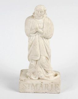 A 18th century Carrara marble figure, modelled as St. Marie wearing flowing robes with hands crossed