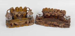 Two late 19th century Black Forest style carved wooden desk stands, each carved with trees and fern