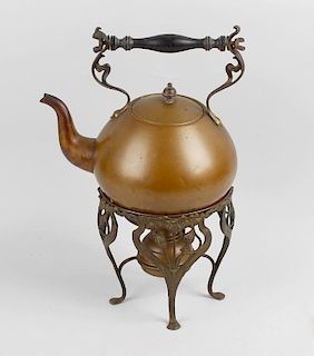 An Art Nouveau copper spirit kettle, of plain bulbous form having stylised foliate fittings supporti