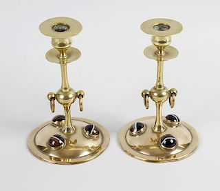 A pair of Victorian brass candlesticks, the columns of knopped form with brass handing ring detail,