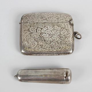 Two items of Birmingham hallmarked silver. Comprising a vesta case with foliate decoration, 1913, ma