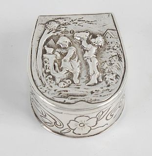 A Dutch silver snuff box of horse shoe form, the hinged opening cover decorated with children drinki