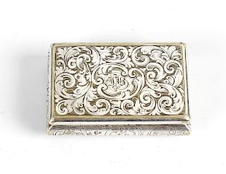 A Victorian white metal snuff box of rectangular shaped form, the top and barreled side with engrave