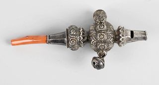 A 19th century white metal child's rattle and whistle, with attached bells and coral teether, 4.75”