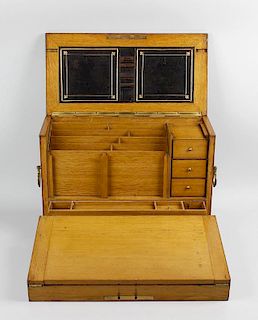 A Victorian coromandel stationery box or cabinet.The hinged rectangular cover with gothic-style stra