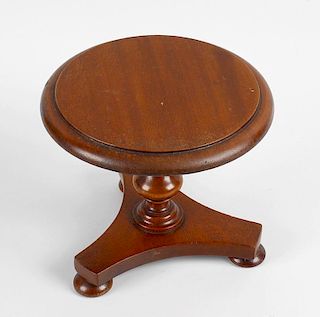A Victorian apprentice miniature mahogany table, the circular top raised upon a knopped baluster ste