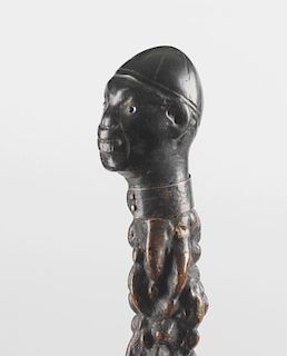 A rootwood walking stick, the carved handle modelled as the head of a African tribesman with inset g