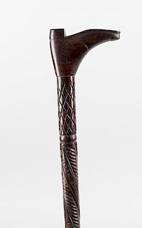 A late nineteenth century carved wooden walking cane, carved with a lizard, snake and emu, together