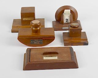Shipbreakers timber. Two wooden inkstands, a shaped wooden desk calendar, a blotter and a box and co
