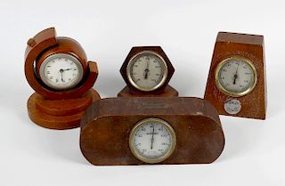 Shipbreakers timber. Three shaped wooden desk thermometers, together with a similar desk clock, each
