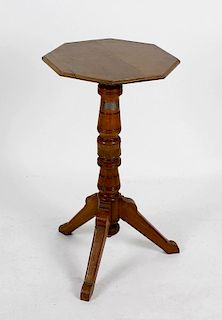 Shipbreakers timber. A turned wooden wine table, the planked octagonal shaped top with moulded edge,
