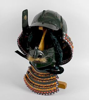 A Japanese Samurai warriors style Kabuto, green painted metal helmet, together with a similar Mempo,