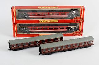 A box containing a good mixed selection of assorted 00 Gauge model railway carriages and rolling sto