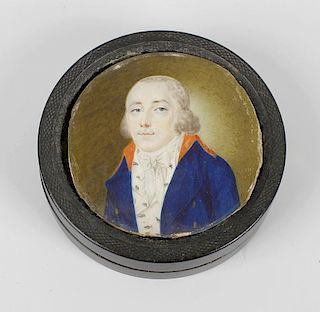 A tortoiseshell box with miniature to top, the cover centred by a circular portrait of a gentleman,