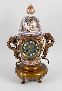 An unusual French Japonesque porcelain and bronzed mantel clock. Samuel Marti, ParisThe 3.25-inch di