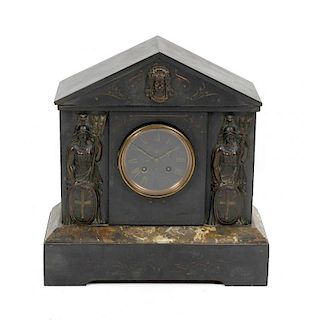 A late 19th century French black slate mantel clockHaving a 3.75-inch black Roman dial, the two-trai