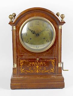 An unusual early 20th century Sonora inlaid mahogany cased bracket style clock with internal fitted