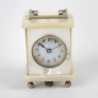 A mother of pearl miniature travelling clock, with 1 (2.5cm) textured Arabic dial, in mother of pear